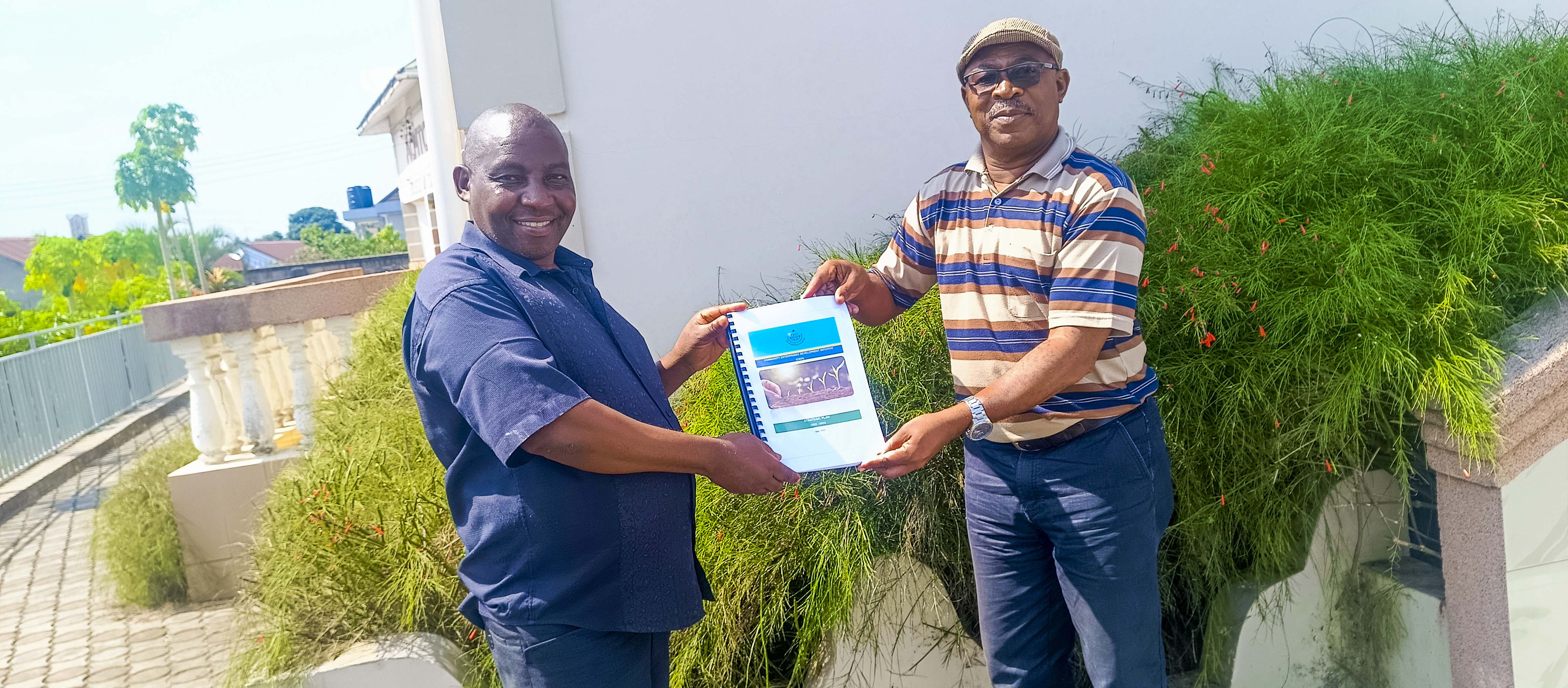 TACED celebrates CEDI’s receipt of their 2025–2028 Strategic Plan, Action Plan & Budget.